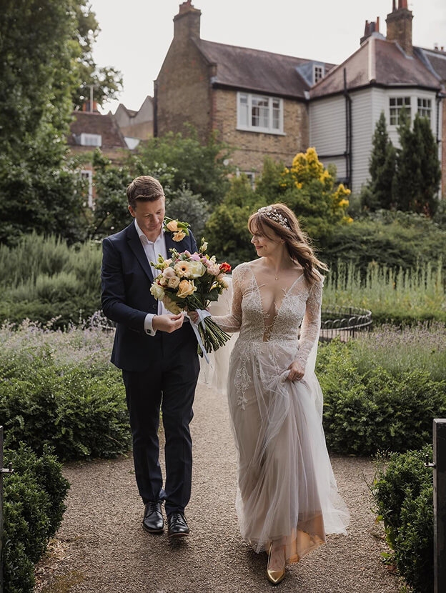 Сouple wearing a gray gown and a black suit